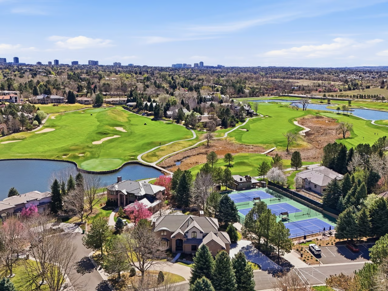 Aerial view of a golf course and estate homes in Cherry Hills Village, Colorado