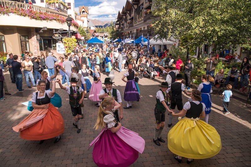Steins of beer raised at an Oktoberfest celebration in Denver, Colorado